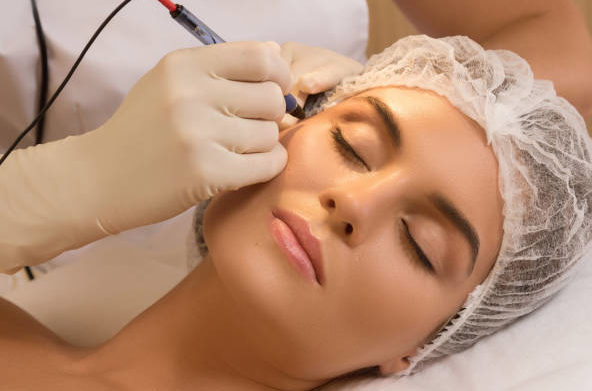 Beautiful woman in cosmetology salon during rejuvenation treatment